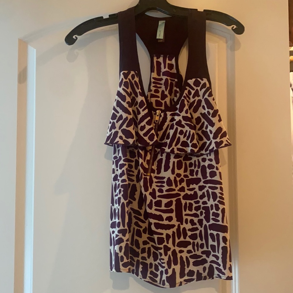Size small. Ruffle and zipper detail. Deep Purple.